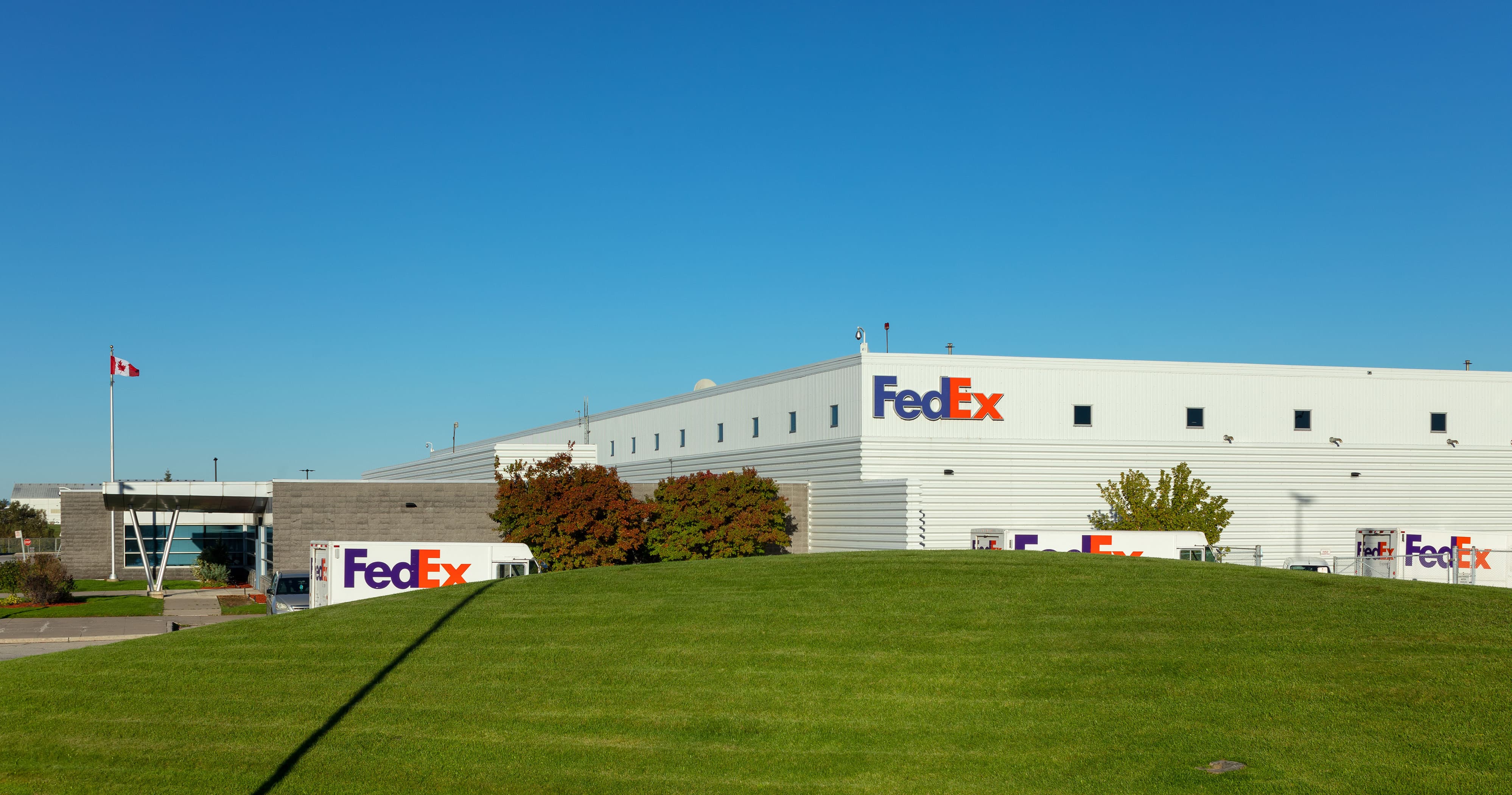 project-fedex-yyz-5-b a building with a fedex trucks leaving