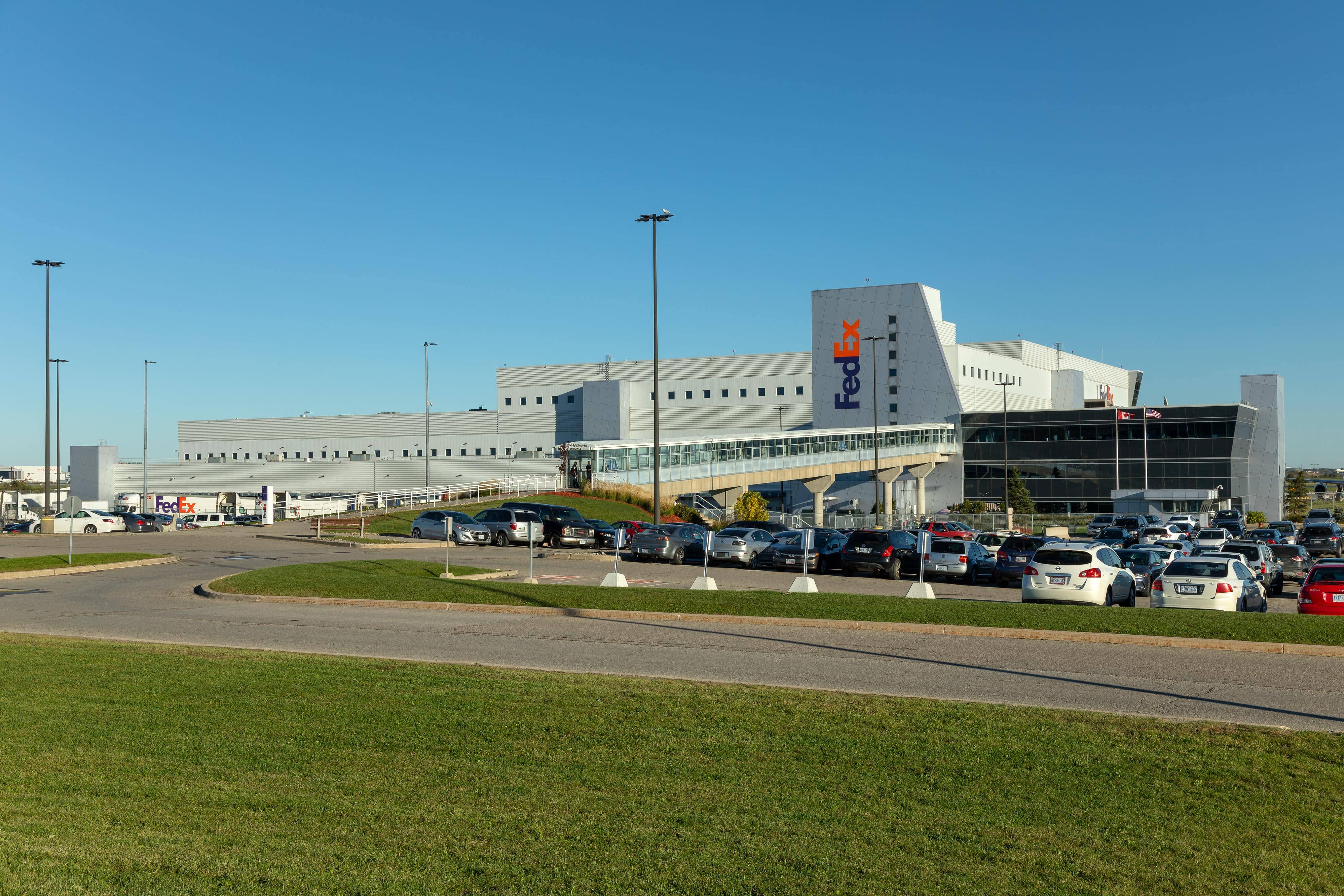 project-fedex-yyz-6-b a large building with cars parked in front of it